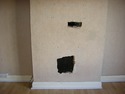 big holes in old fireplace needs filling &amp; covering