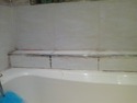 Tile a shelf along the length of bath