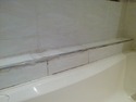 Tile a shelf along the length of bath