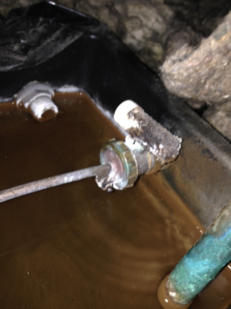 Replace leaking overflow ball valve in loft tank