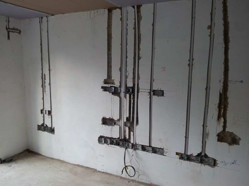 Rendering wall chases and concreting floor recesses Plastering job in