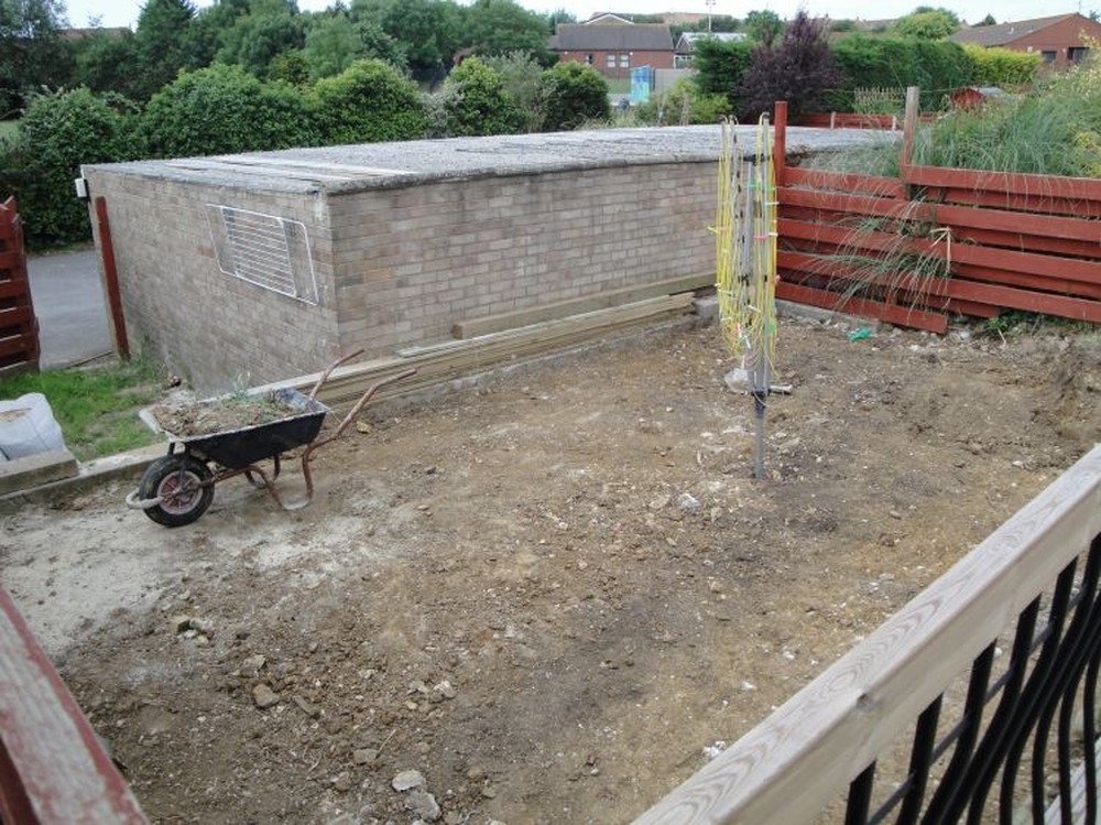 Lay patio slabs, build smal wall Landscape Gardening job in Weymouth