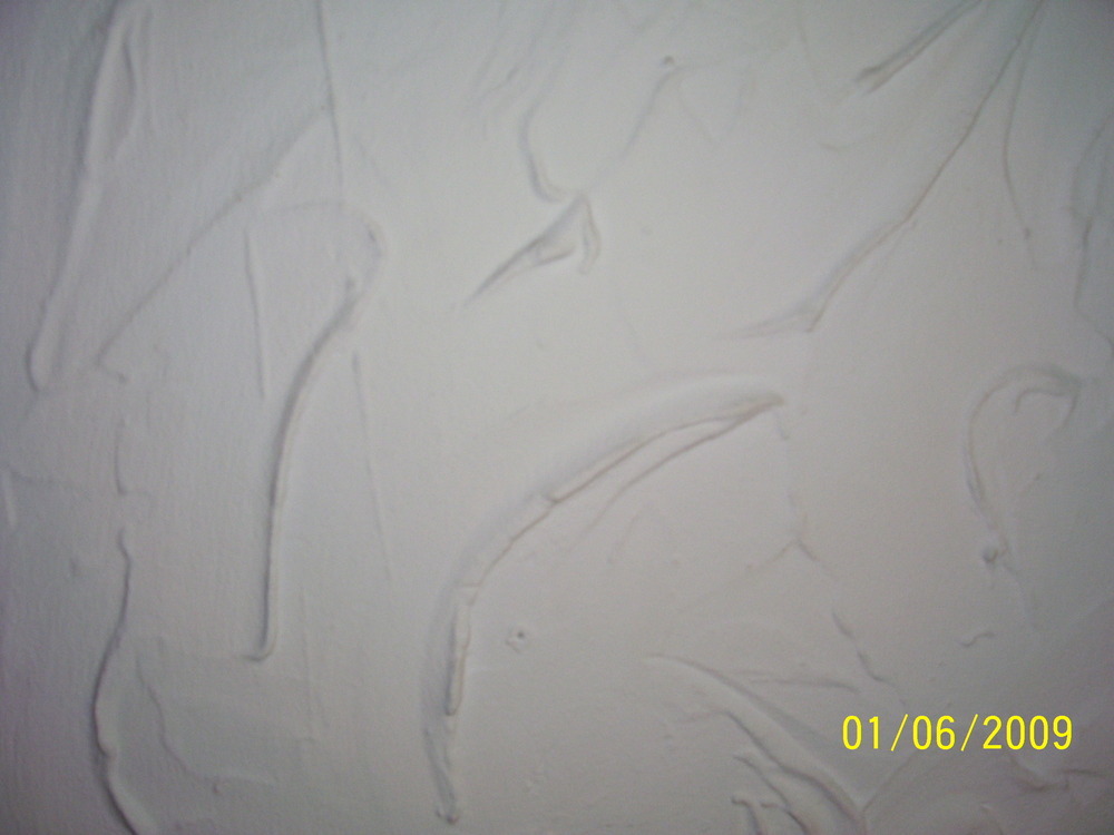 smooth over artex in living room. Plastering job in Basildon, Essex
