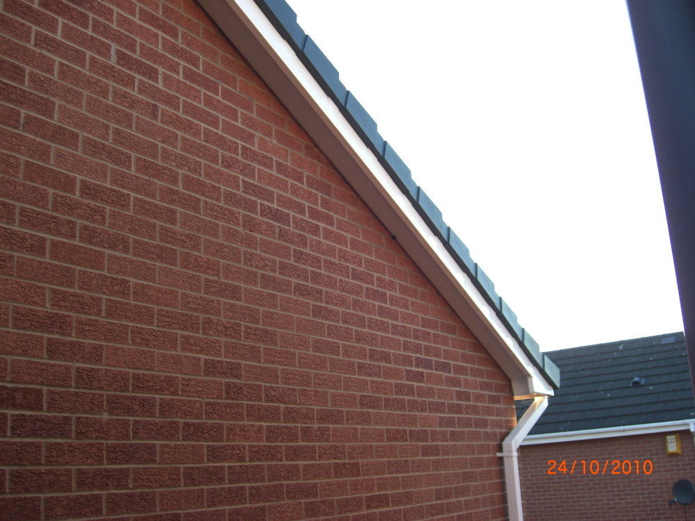 Plastic end caps need fitting to gable ends of roof Roofing job in