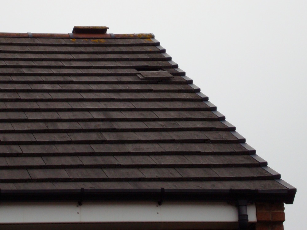 Single tile off roof + section of loose flashing Roofing job in Leeds